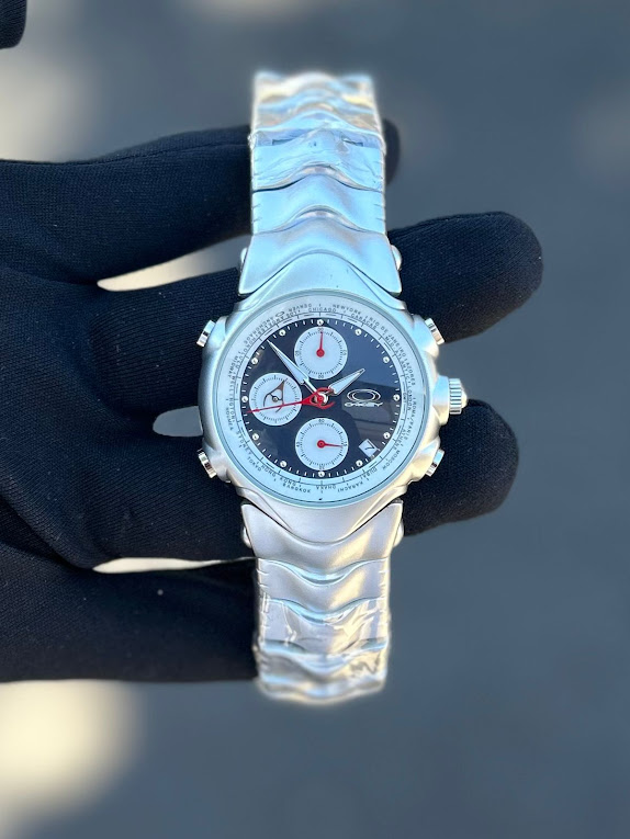 Relógio Oakley GMT Prata com Preto no Atacado - Pulseira de Aço - 100% Funcional | Relógios Para Revender Relógio Oakley GMT Prata com Preto no Atacado – Pulseira de Aço