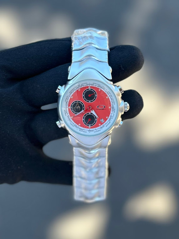 Relógio Oakley GMT Prata com Laranja no Atacado - Pulseira de Aço | Relógios Para Revender Relógio Oakley GMT Prata com Laranja no Atacado