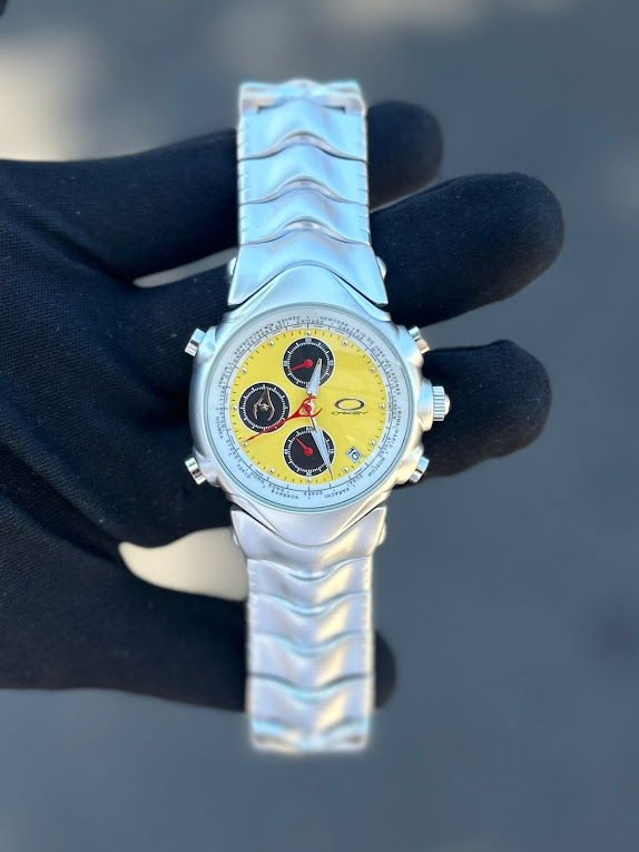 Relógio Oakley GMT Prata Com Amarelo no Atacado - Pulseira de Aço | Relógios Para Revender Relógio Oakley GMT Prata com Preto no Atacado – Pulseira de Aço